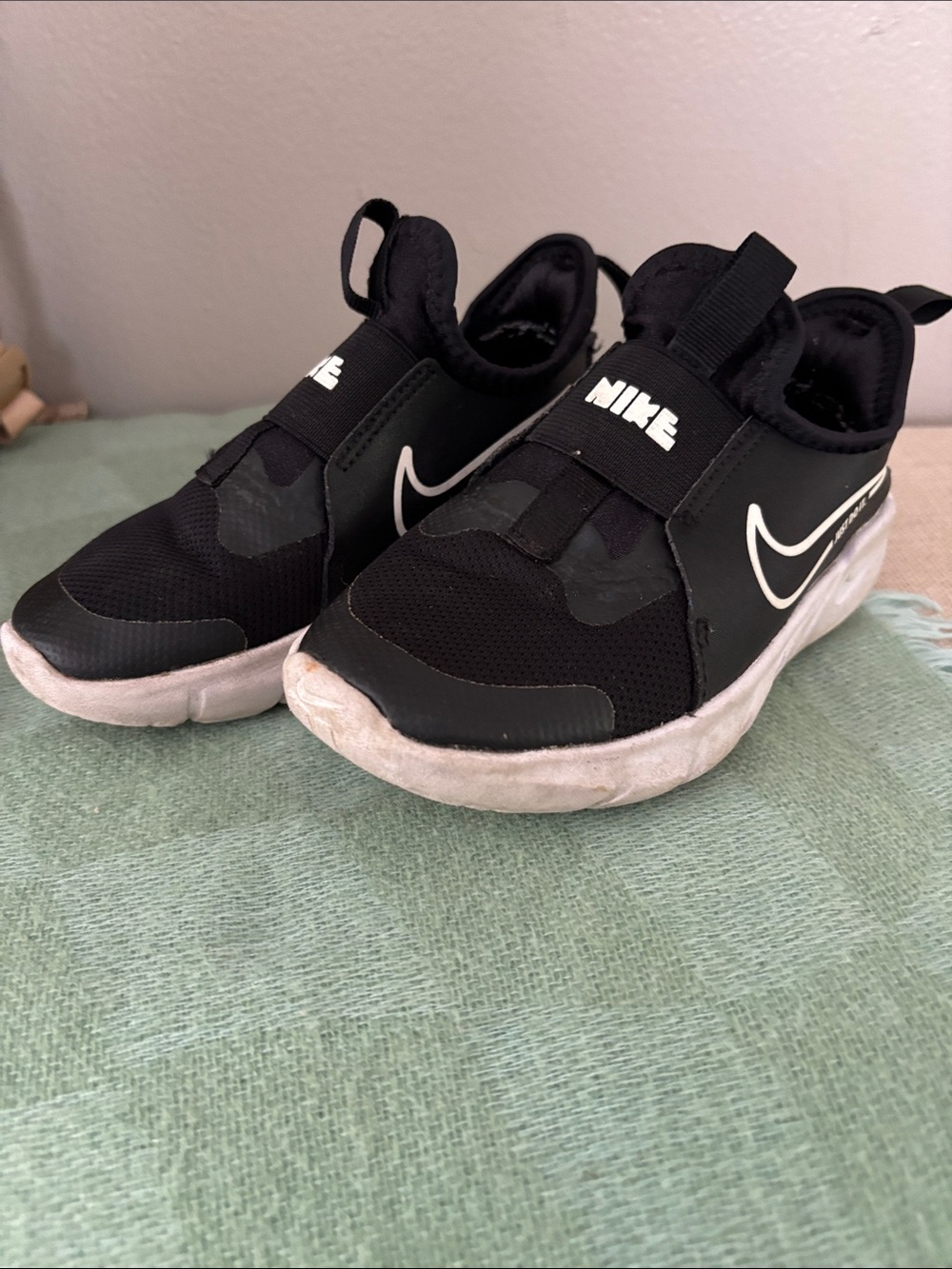 Nike Kids Black Slip-On Sneakers with White Swoosh